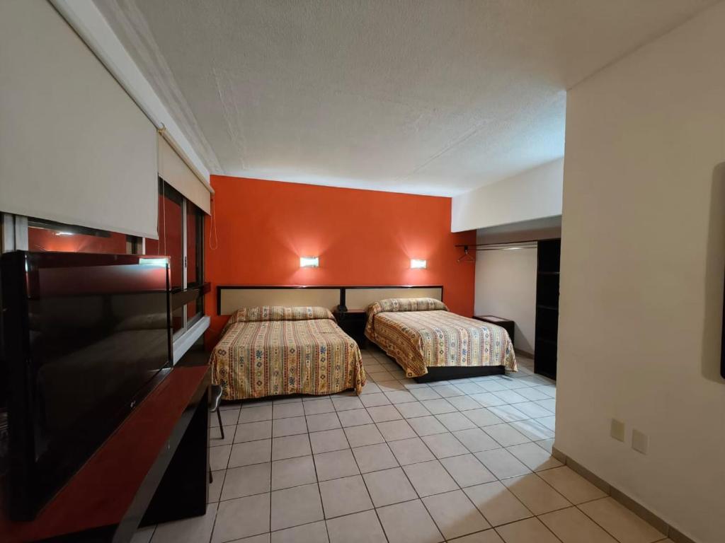 Postel nebo postele na pokoji v ubytování Hotel Montreal