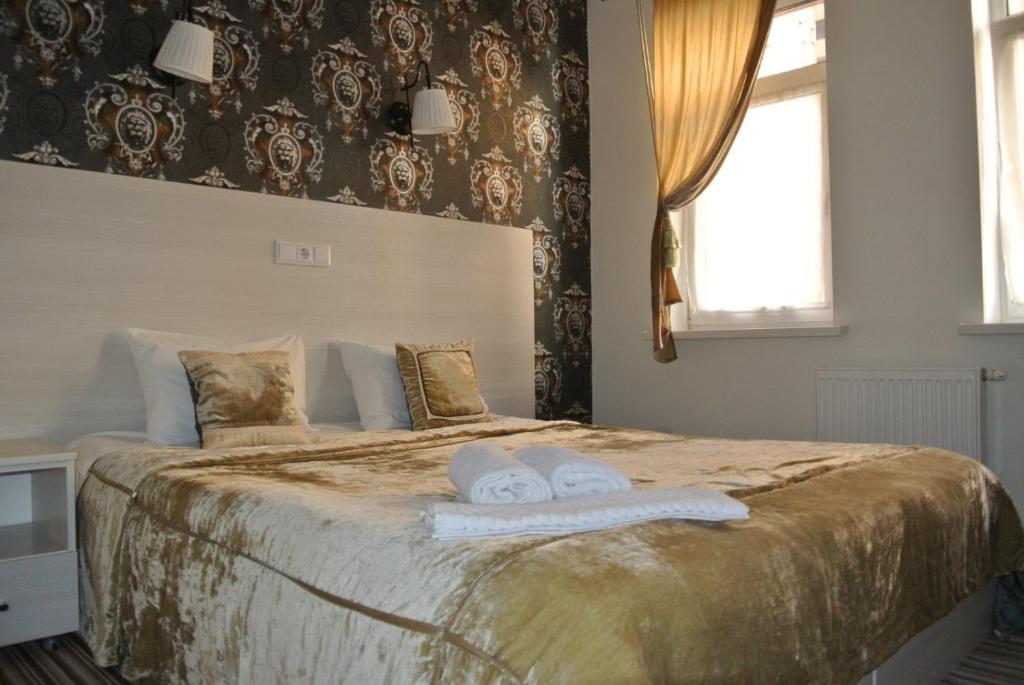 Postel nebo postele na pokoji v ubytování Mini Hotel on Poznyaky