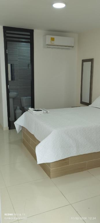 Postel nebo postele na pokoji v ubytování Habitaciones Cataleya Valledupar