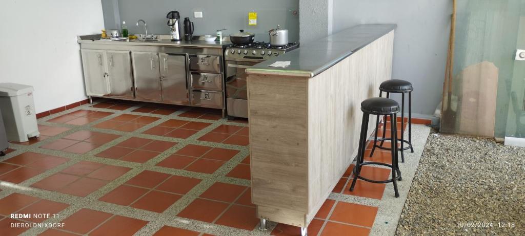 Kuchyň nebo kuchyňský kout v ubytování Habitaciones Cataleya Valledupar