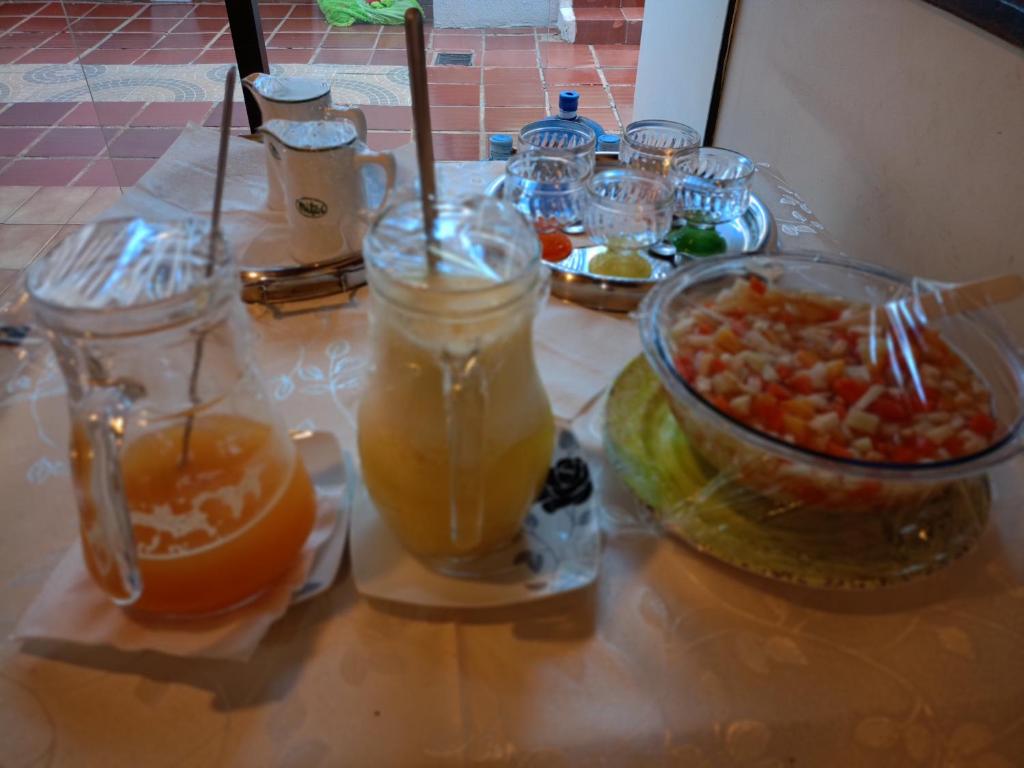 a table topped with different types of food and drinks at RESIDENCIA-UNIV in Ciudad del Este