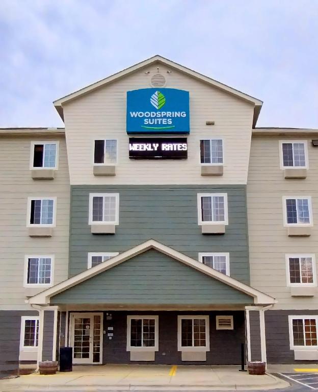 a view of the front of a wocassurance building at WoodSpring Suites Asheville - Biltmore West in Asheville