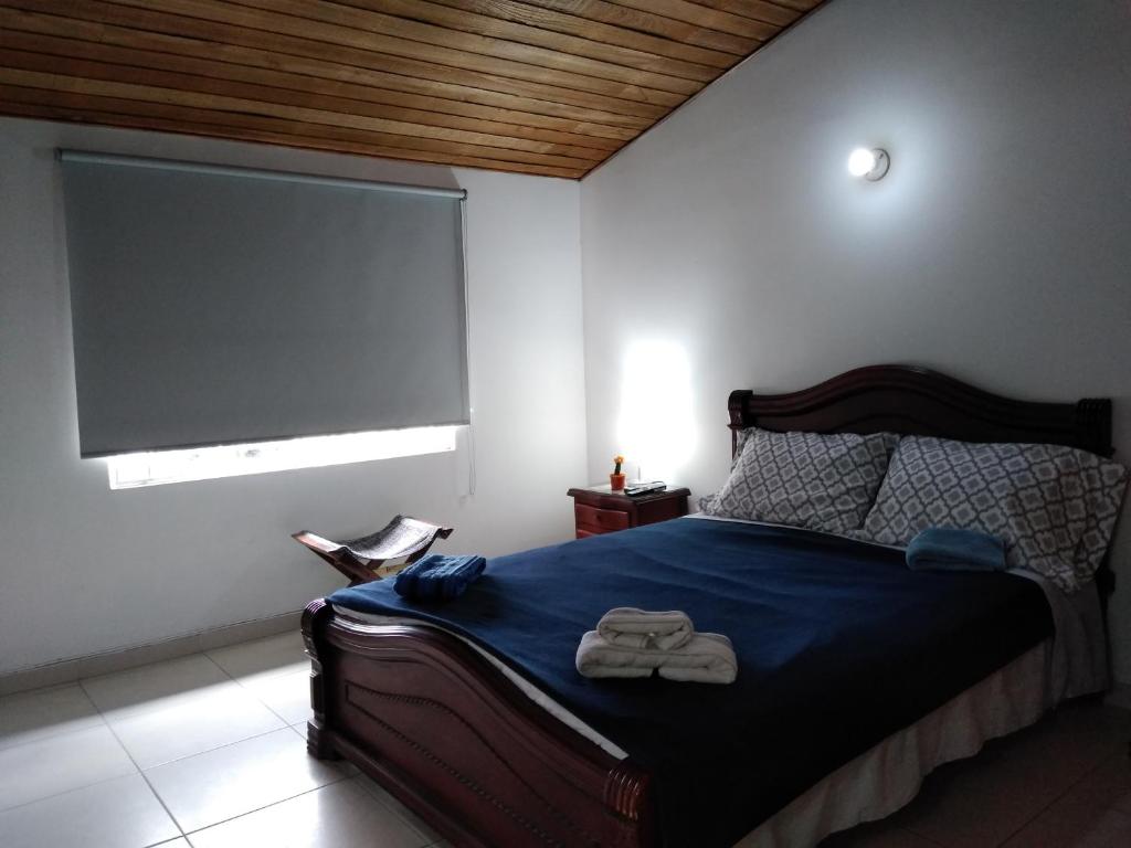 Postel nebo postele na pokoji v ubytování Hostal Norma101