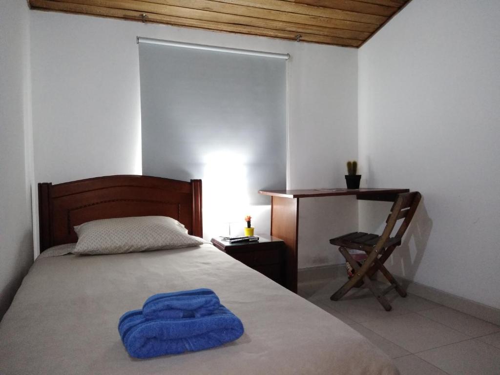 Postel nebo postele na pokoji v ubytování Hostal Norma101