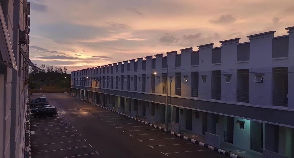 a view of a parking lot with a building at SohoMimi Seri Iskandar in Kampung Bota Kiri