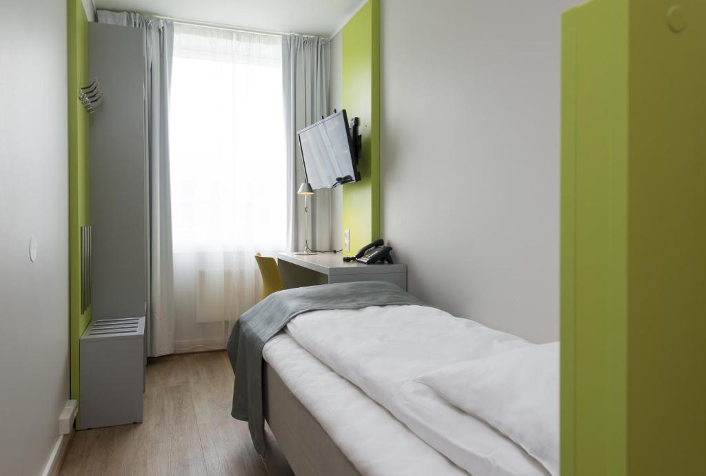 Postel nebo postele na pokoji v ubytování Thon Hotel Trondheim