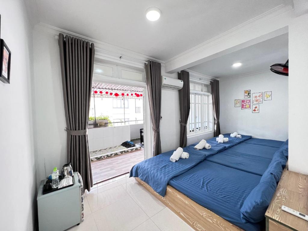 Postel nebo postele na pokoji v ubytování Hotel Đông Nhi