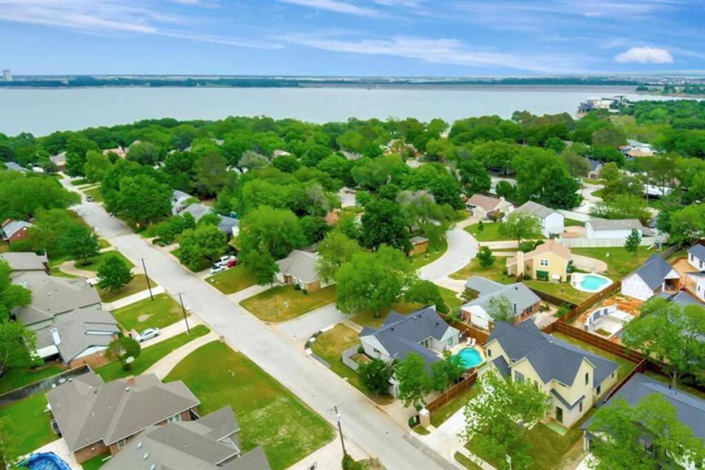 an aerial view of a residential neighborhood with a lake at Grapevine Oasis, with Pool in Grapevine