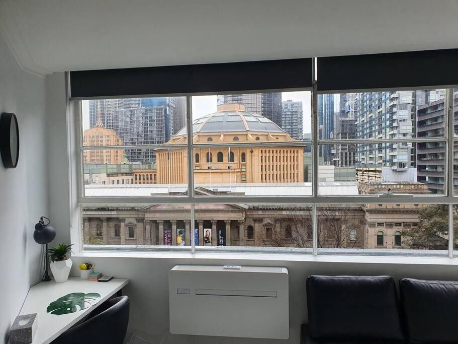 a window with a view of a large building at Instaworthy views Ace Location Walk Everywhere in Melbourne