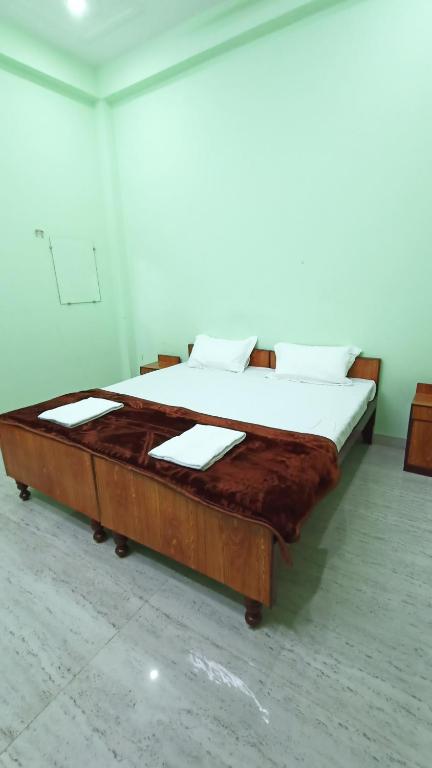 Voodi või voodid majutusasutuse ARJUN PAYING GUEST HOUSE toas