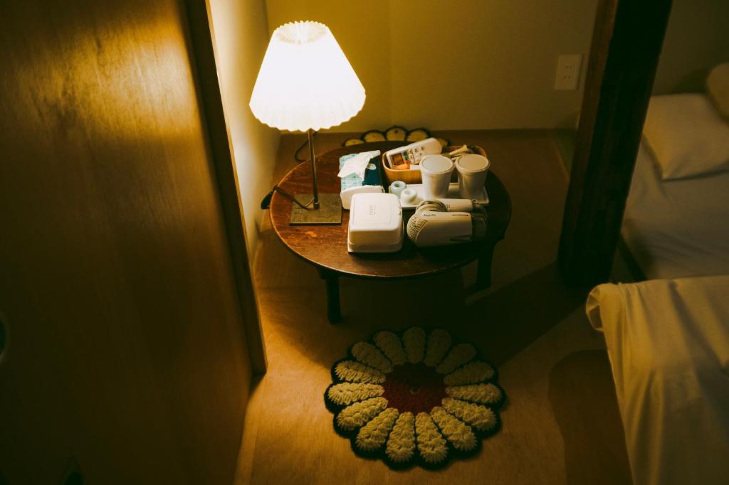 Postel nebo postele na pokoji v ubytování Sumida Nagaya