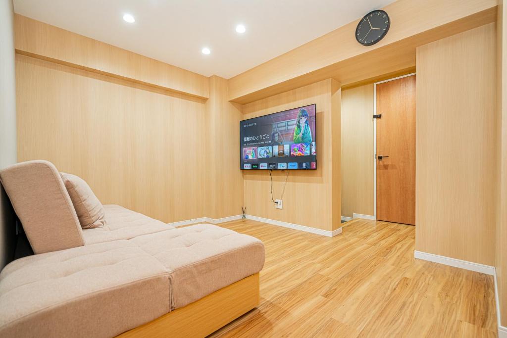 TV a/nebo společenská místnost v ubytování Sakura Suite 404