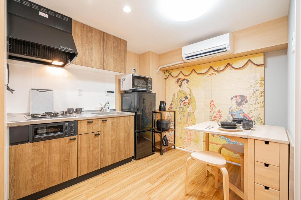 Kuchyň nebo kuchyňský kout v ubytování Sakura Suite 404