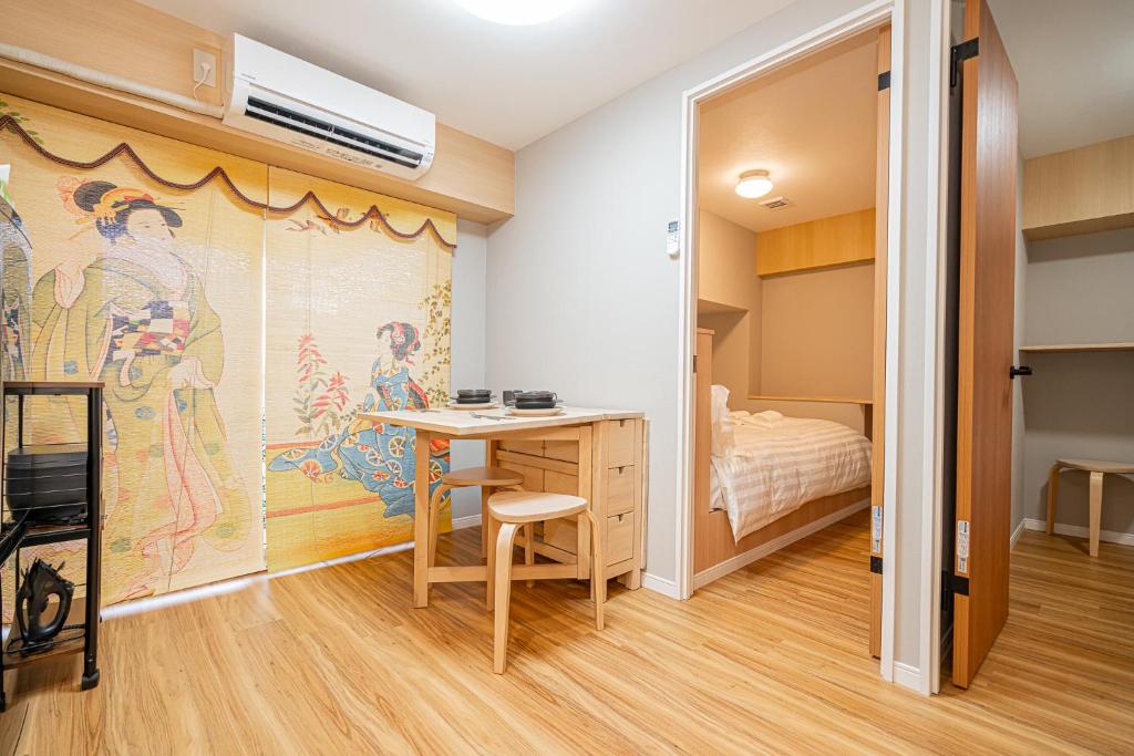 Postel nebo postele na pokoji v ubytování Sakura Suite 404