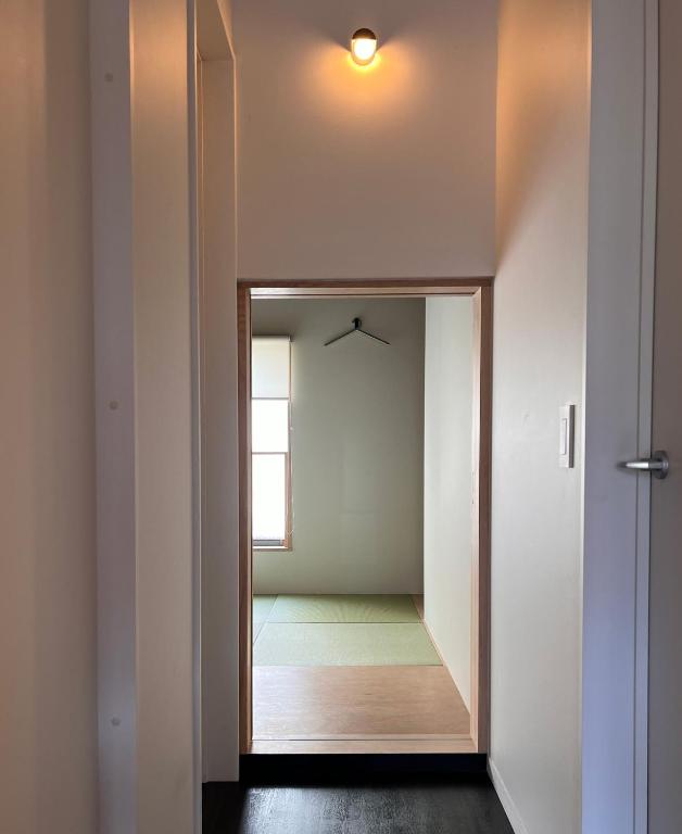Postel nebo postele na pokoji v ubytování Sumida Nagaya