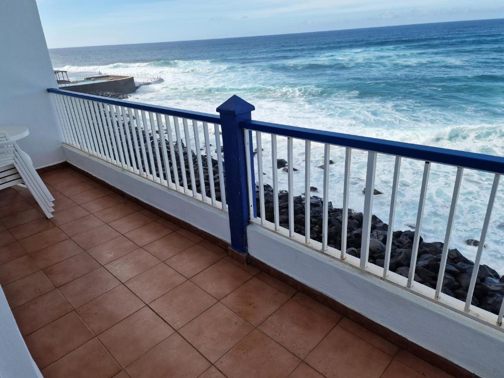 a balcony with a view of the ocean at Bajamar Oasis in Bajamar