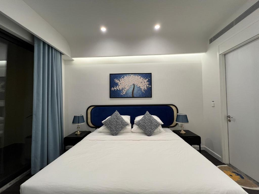 Oscar Seaview Apartment tesisinde bir odada yatak veya yataklar