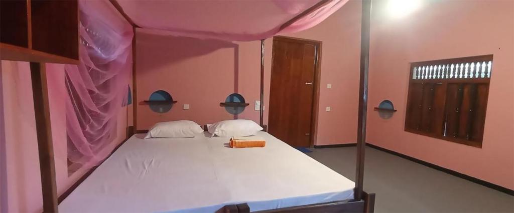 Postel nebo postele na pokoji v ubytování Breezy Beach Cabanas