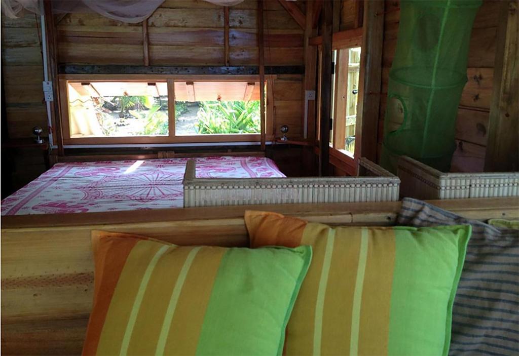 Postel nebo postele na pokoji v ubytování Breezy Beach Cabanas