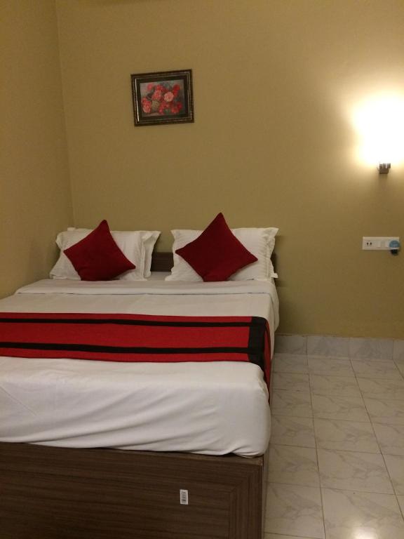 Postel nebo postele na pokoji v ubytování HOTEL BREEZE NEW JALPAIGURI