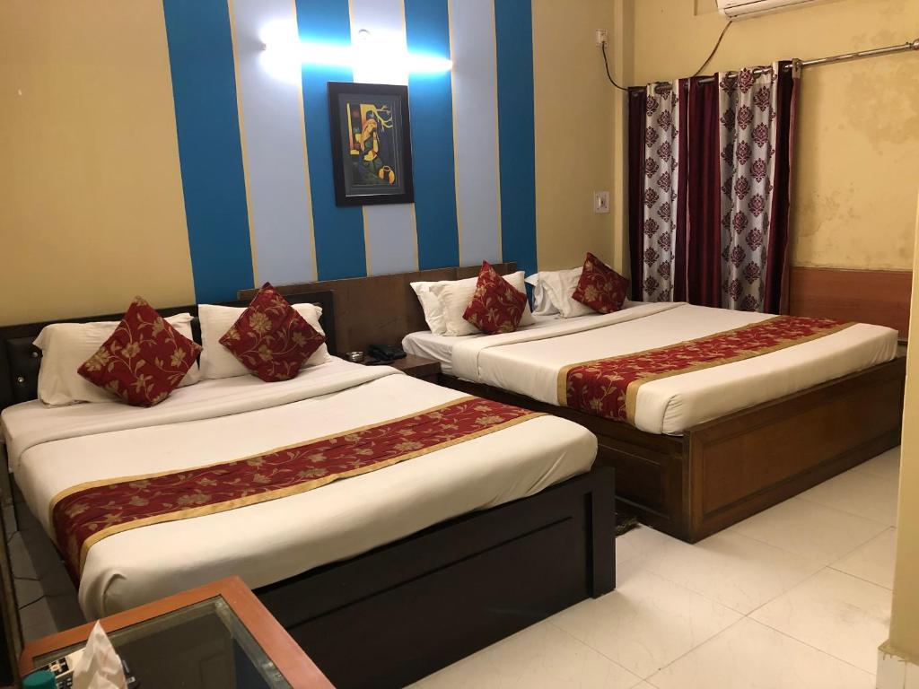Postel nebo postele na pokoji v ubytování HOTEL BREEZE NEW JALPAIGURI