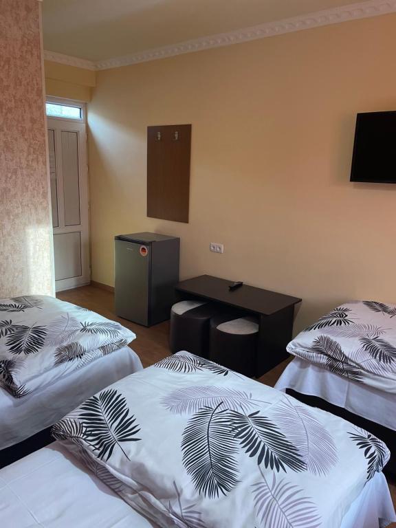 Postel nebo postele na pokoji v ubytování Zangu Hotel