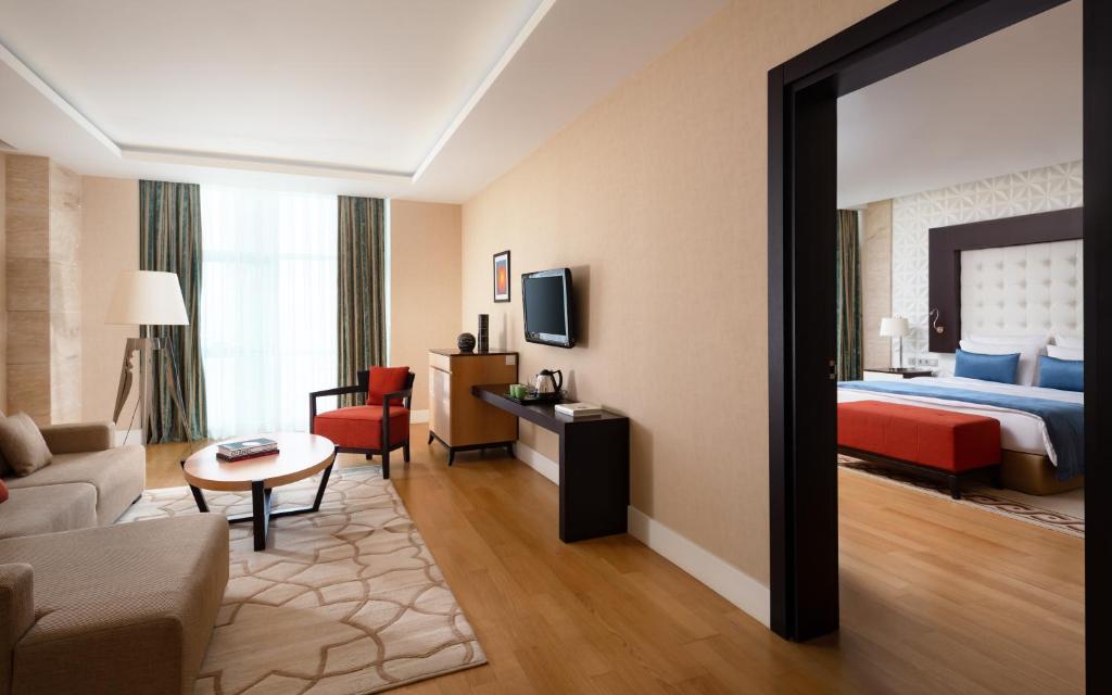 Postel nebo postele na pokoji v ubytování Badamdar Hotel and Residences