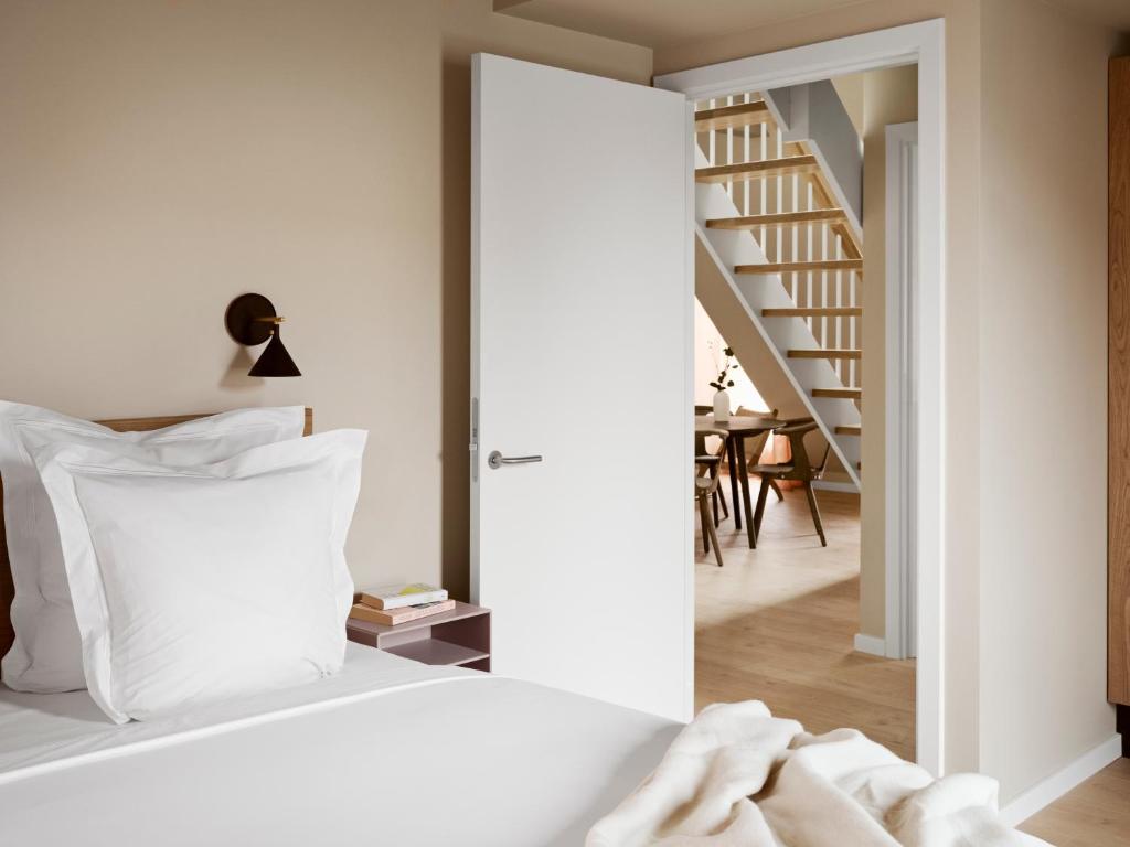 Voodi või voodid majutusasutuse Aura Apartment Hotel toas
