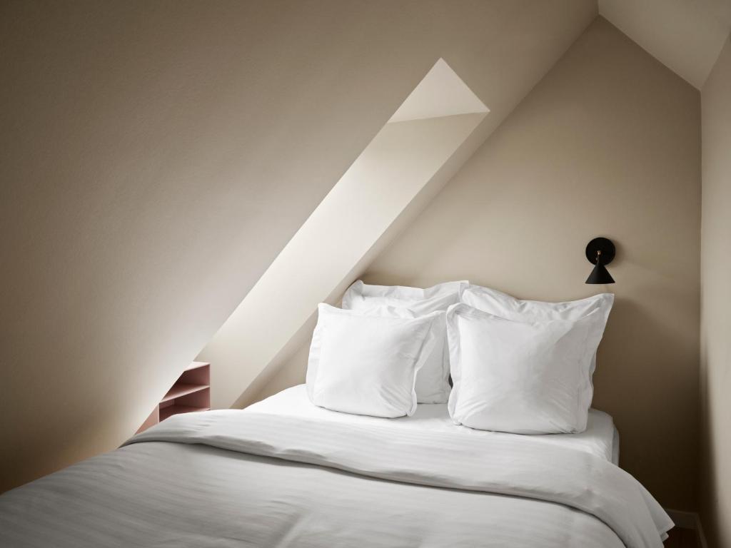 Voodi või voodid majutusasutuse Aura Apartment Hotel toas