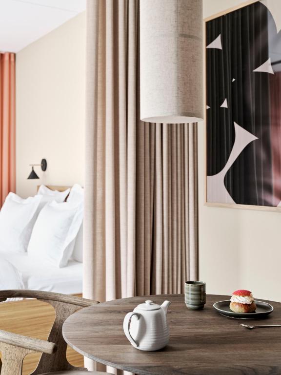 Voodi või voodid majutusasutuse Aura Apartment Hotel toas