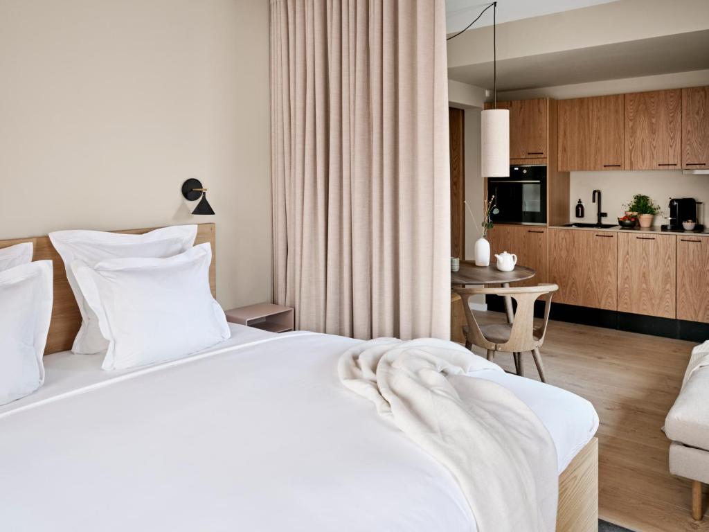 Voodi või voodid majutusasutuse Aura Apartment Hotel toas