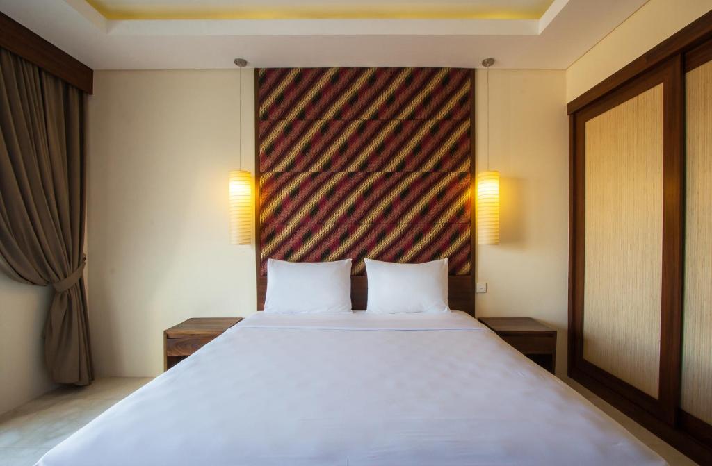 Postel nebo postele na pokoji v ubytování M Suite Bali