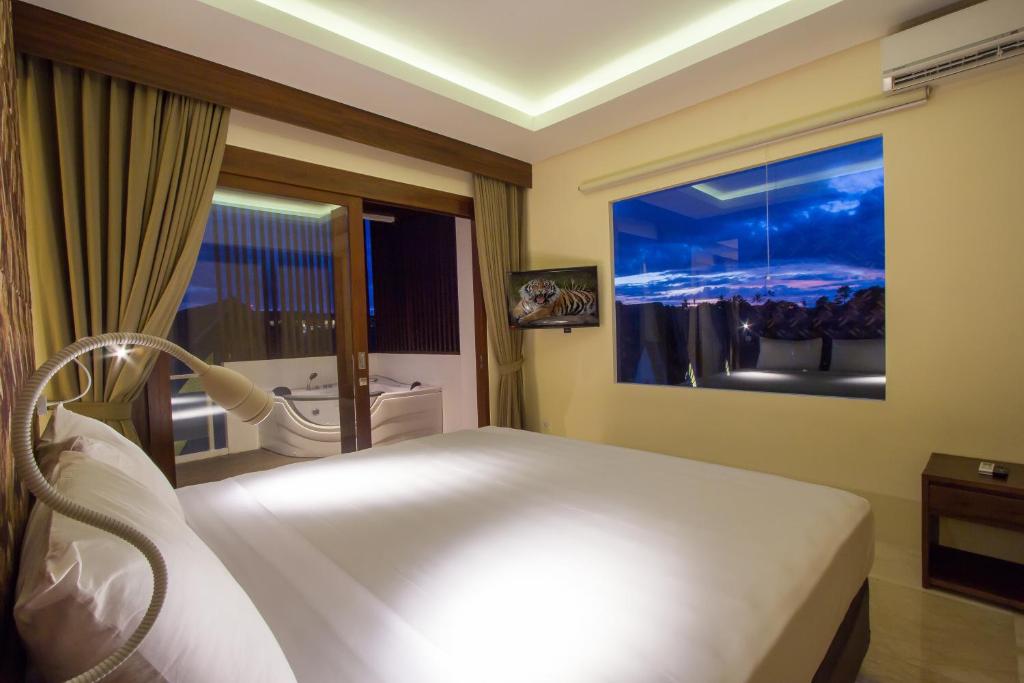 Postel nebo postele na pokoji v ubytování M Suite Bali