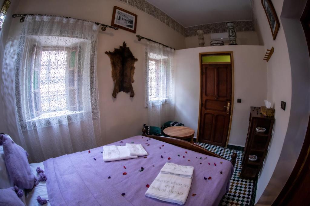 Postel nebo postele na pokoji v ubytování Dar alhaja rahma