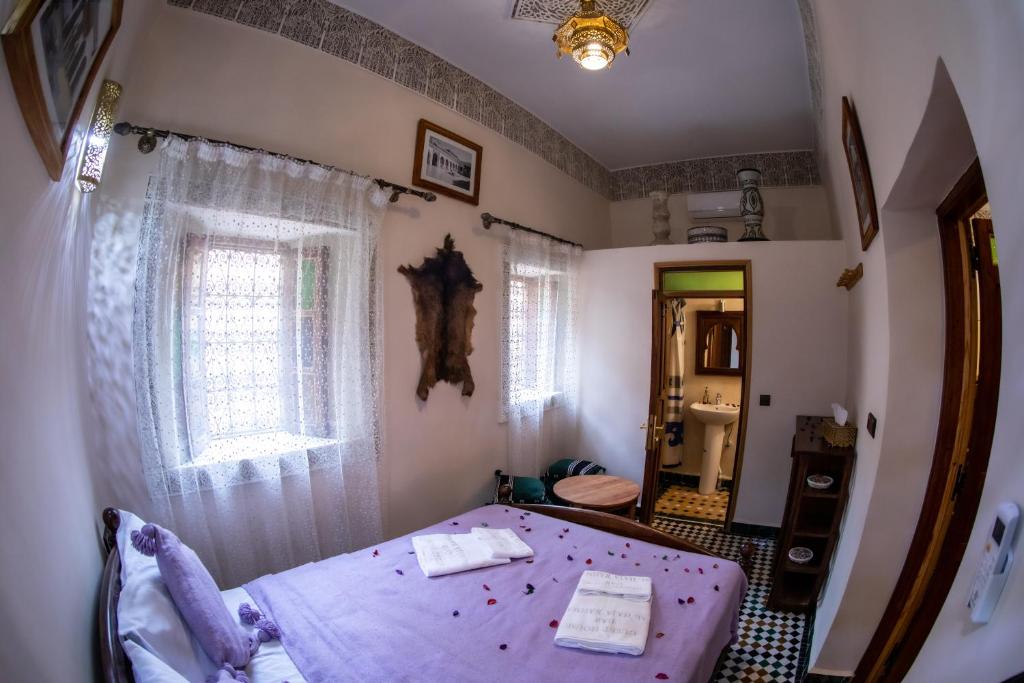 Postel nebo postele na pokoji v ubytování Dar alhaja rahma