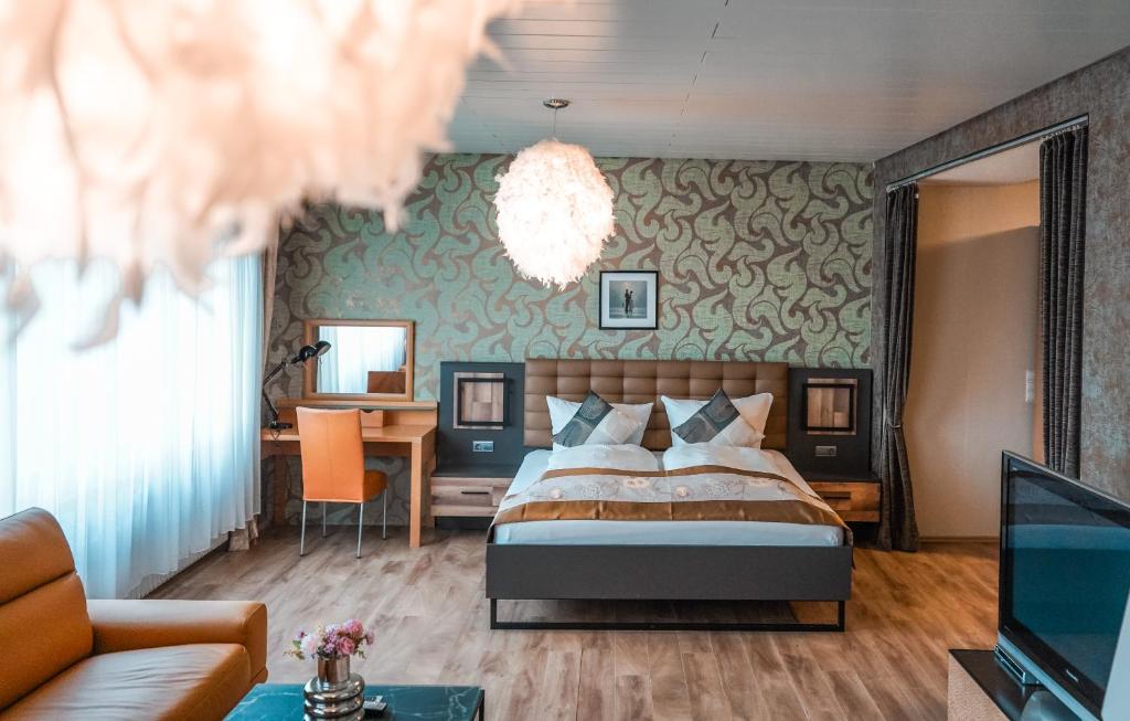 Postel nebo postele na pokoji v ubytování Hotel Palatino