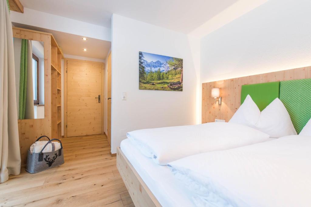 Postel nebo postele na pokoji v ubytování Landhaus Sunseitn