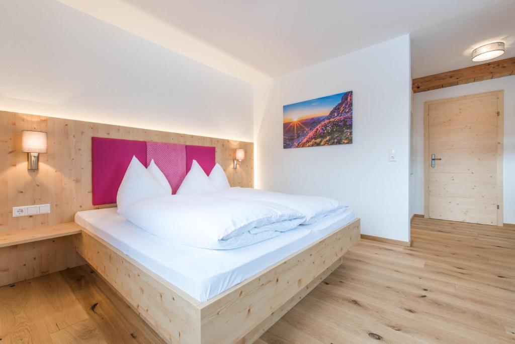 Postel nebo postele na pokoji v ubytování Landhaus Sunseitn