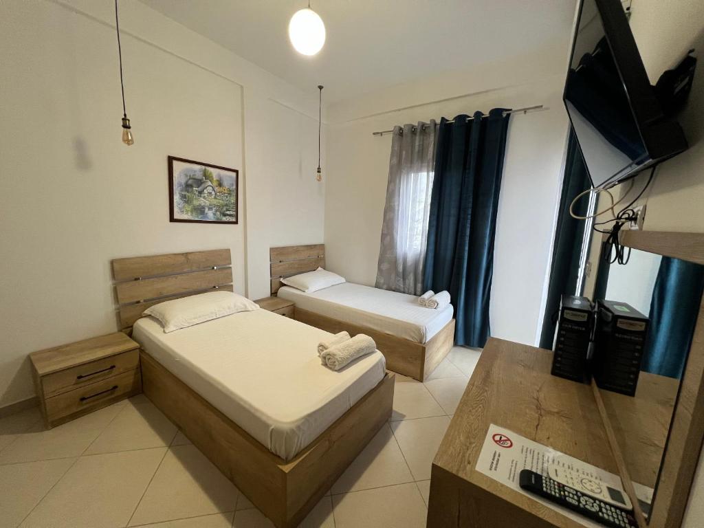 Postel nebo postele na pokoji v ubytování Hotel Apostoli