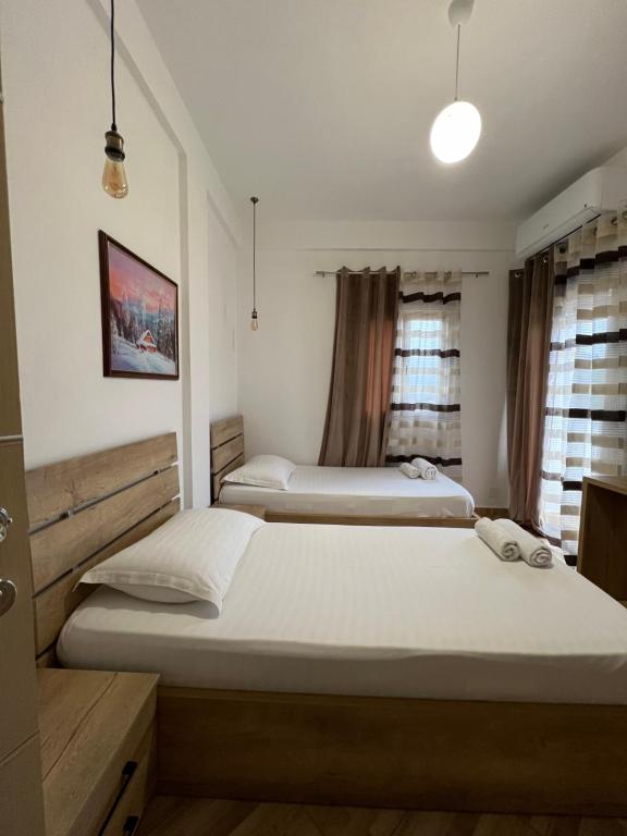 Postel nebo postele na pokoji v ubytování Hotel Apostoli