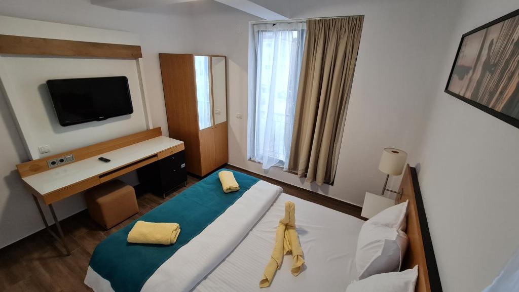 Postel nebo postele na pokoji v ubytování Jafar Resort 7