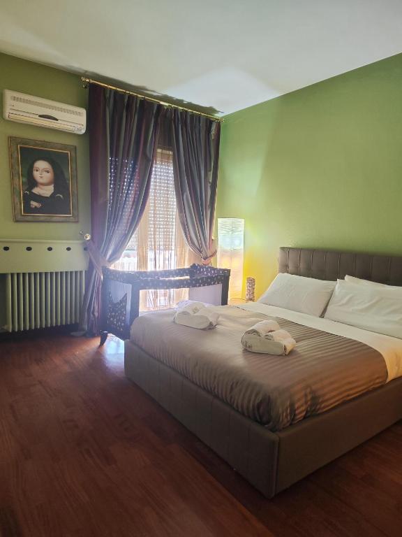 Łóżko lub łóżka w pokoju w obiekcie Casa vacanza "IL GIRASOLE"