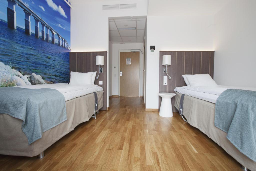 Postel nebo postele na pokoji v ubytování Hotel Skansen