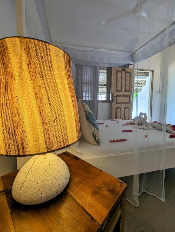 Postel nebo postele na pokoji v ubytování Bahati Villa