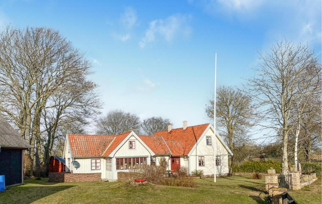 a large white house with an orange roof at 3 Bedroom Amazing Home In Borgholm in Borgholm