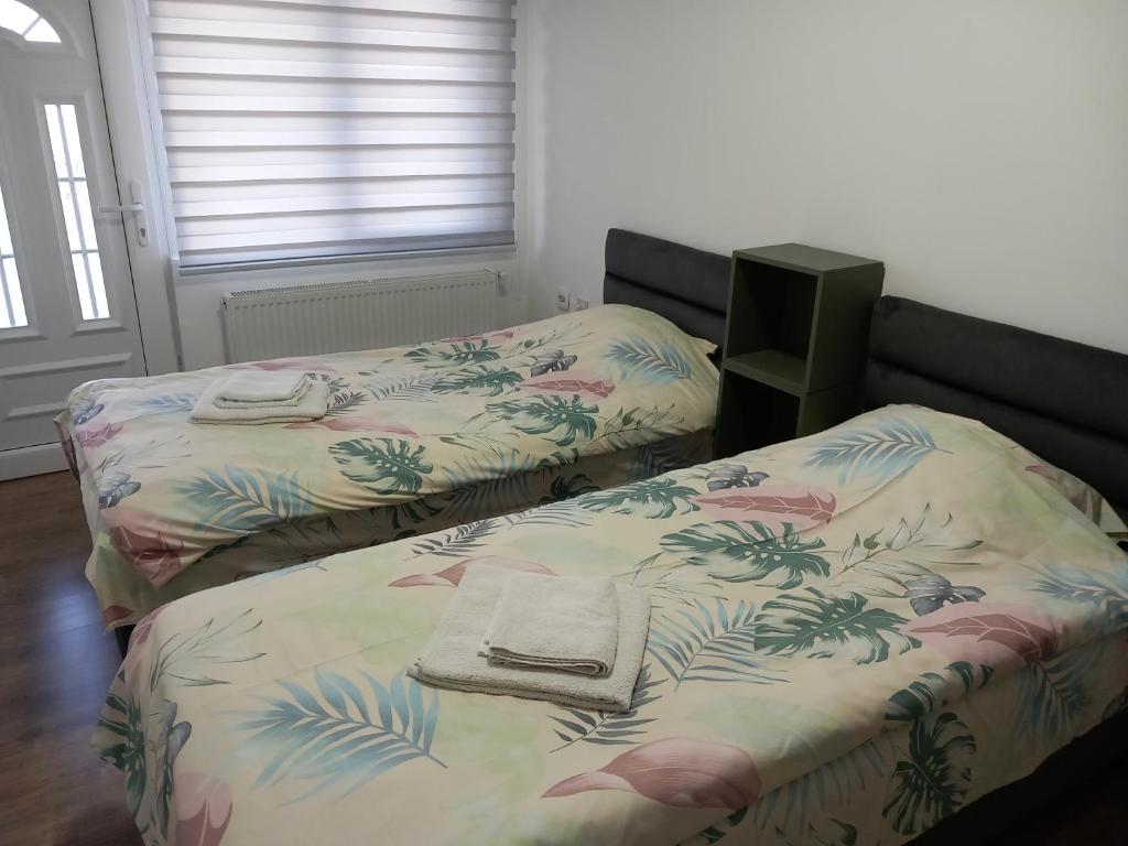 Postelja oz. postelje v sobi nastanitve Apartmani Ćosić