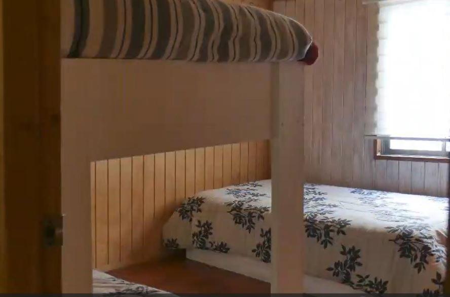 Postel nebo postele na pokoji v ubytování HOSTAL CARHUELLO