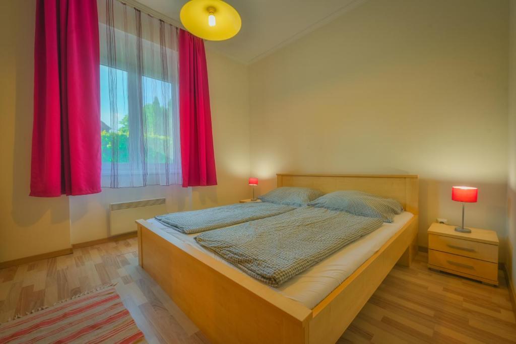 Posteľ alebo postele v izbe v ubytovaní Dora Ház