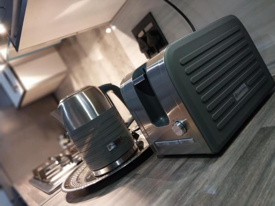a coffee maker sitting on top of a kitchen counter at Maneli 69 in Boksburg