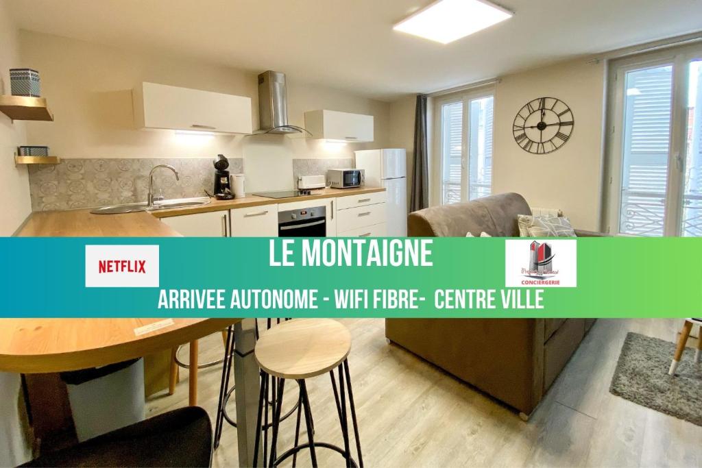 Bild einer Küche mit den Worten le montreal application applianceschreibe depot in der Unterkunft LE MONTAIGNE - Wifi fibre- Coeur du centre ville-PROPERTY RENTAL NM in Périgueux